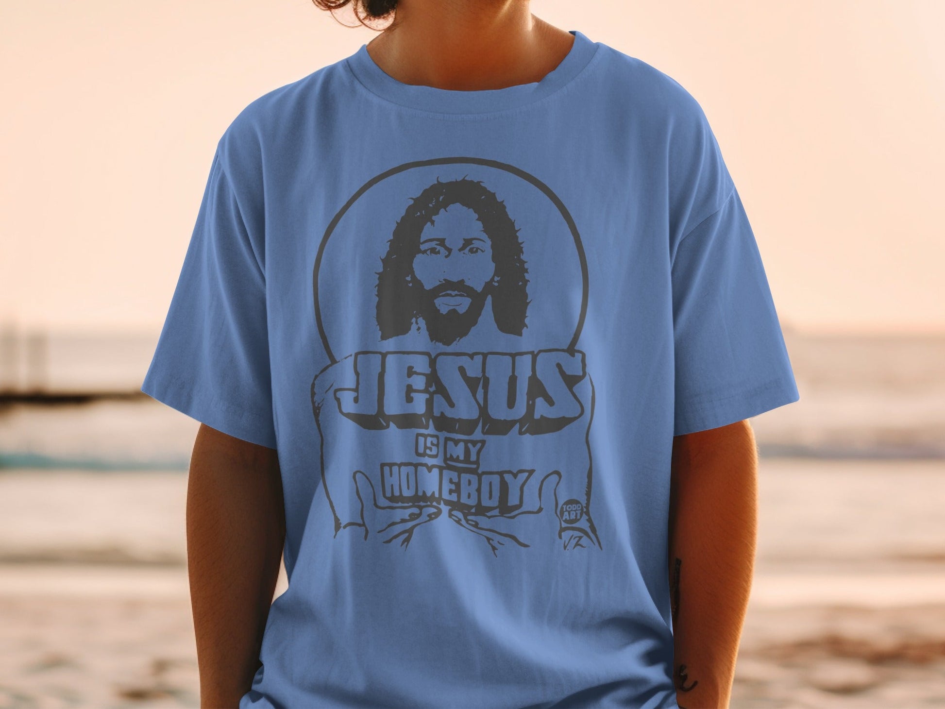 Blue t-shirt with "Jesus is my homeboy" and a portrait of Jesus.