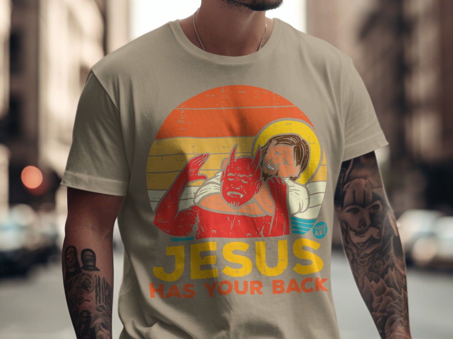 Jesus has your back graphic on a t-shirt with devil figure.