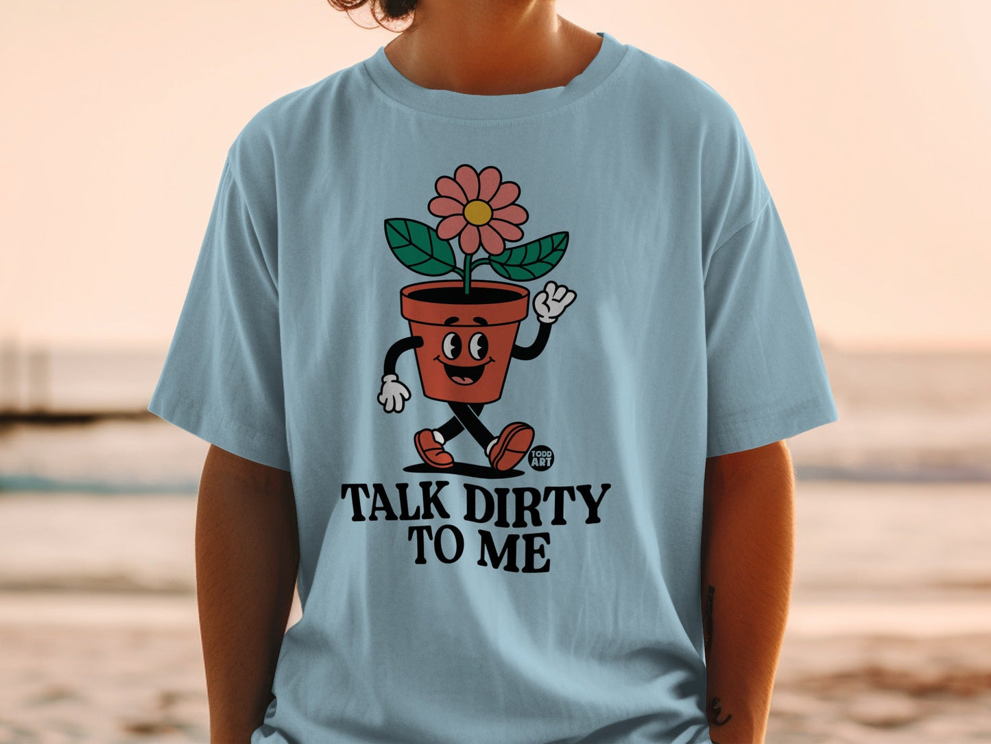 Light blue t-shirt with animated flower pot saying "Talk Dirty To Me".
