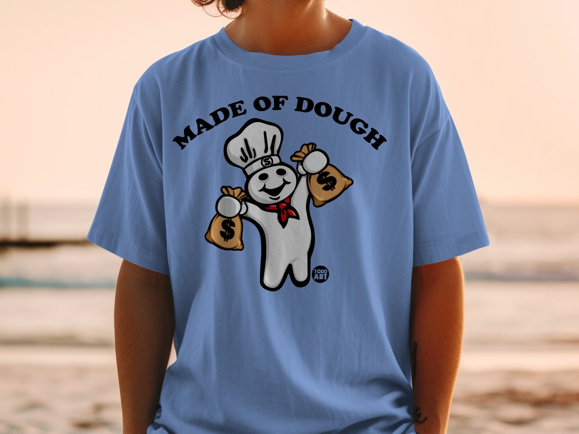 Pillsbury Doughboy with money bags, "Made of Dough" text.