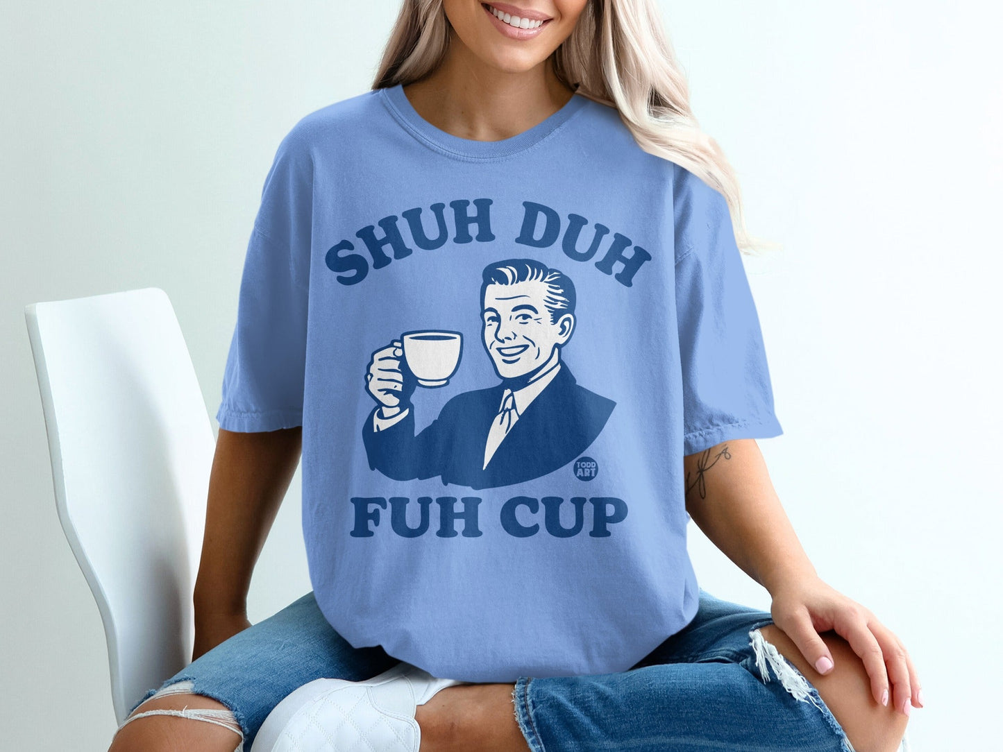 Blue t-shirt with "SHUH DUH FUH CUP" and retro man holding coffee cup.
