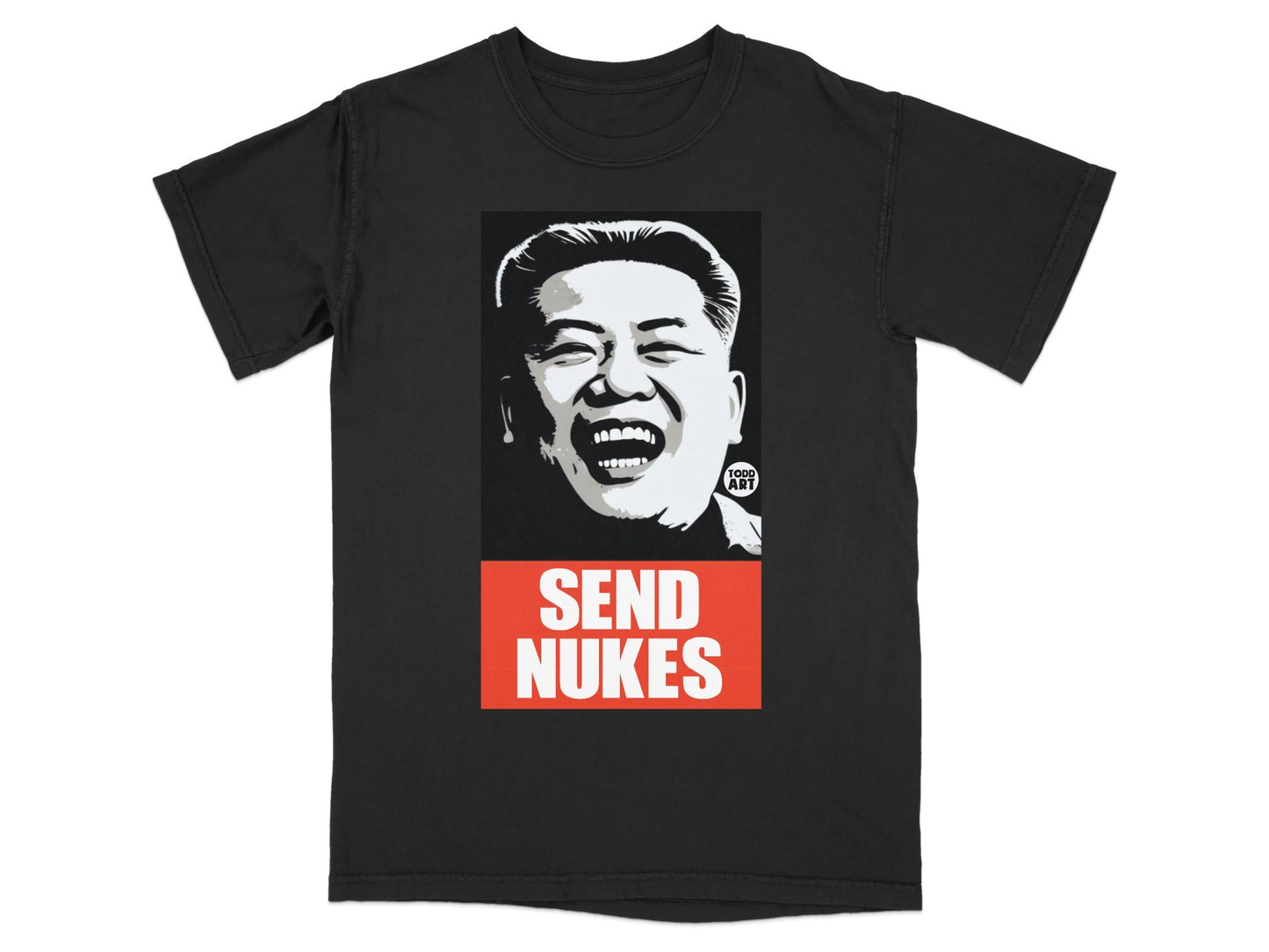 Black t-shirt with a laughing portrait of Kim Jong Un and "SEND NUKES" text.