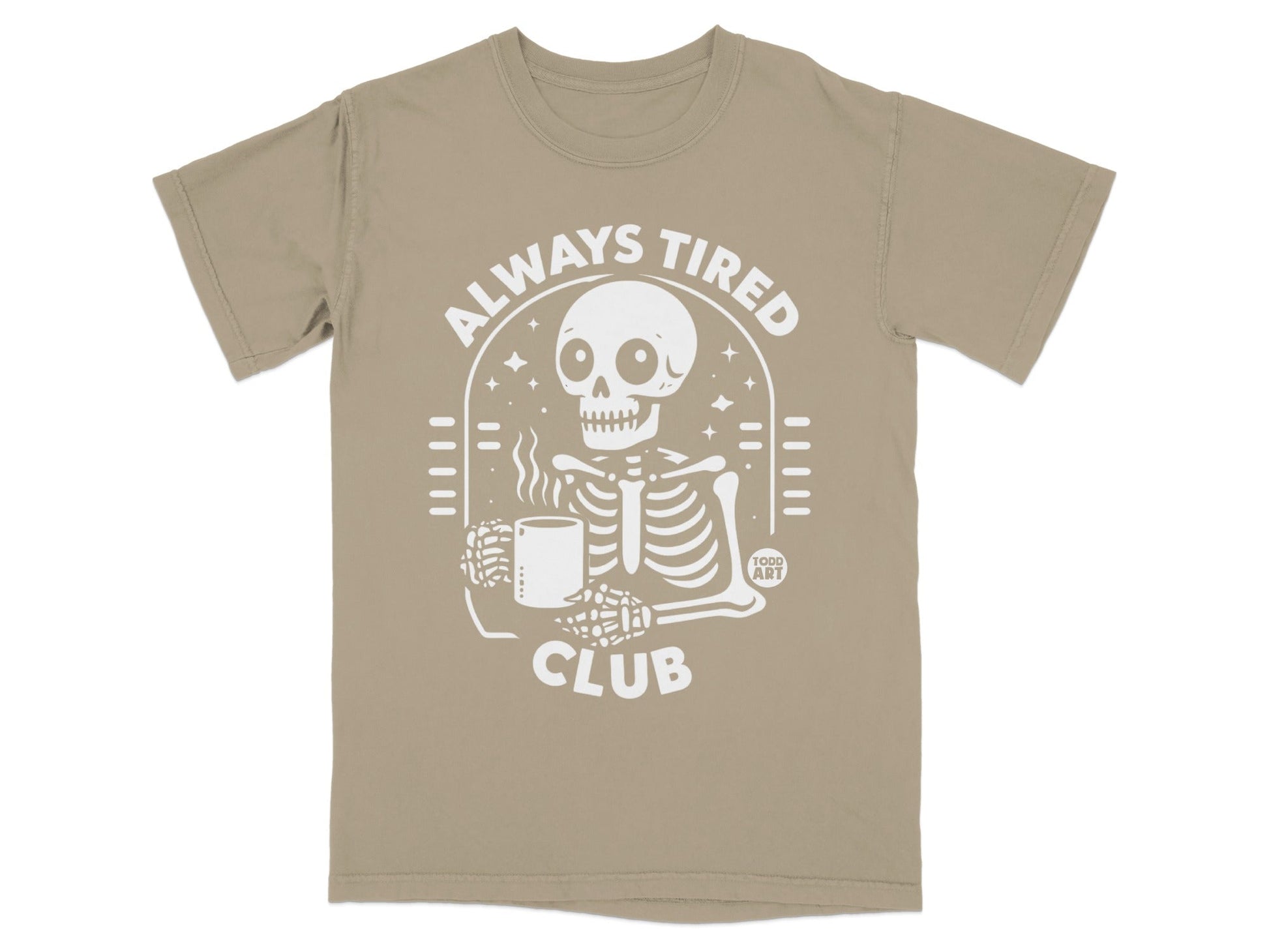 Skeleton in "ALWAYS TIRED CLUB" t-shirt holding a mug.