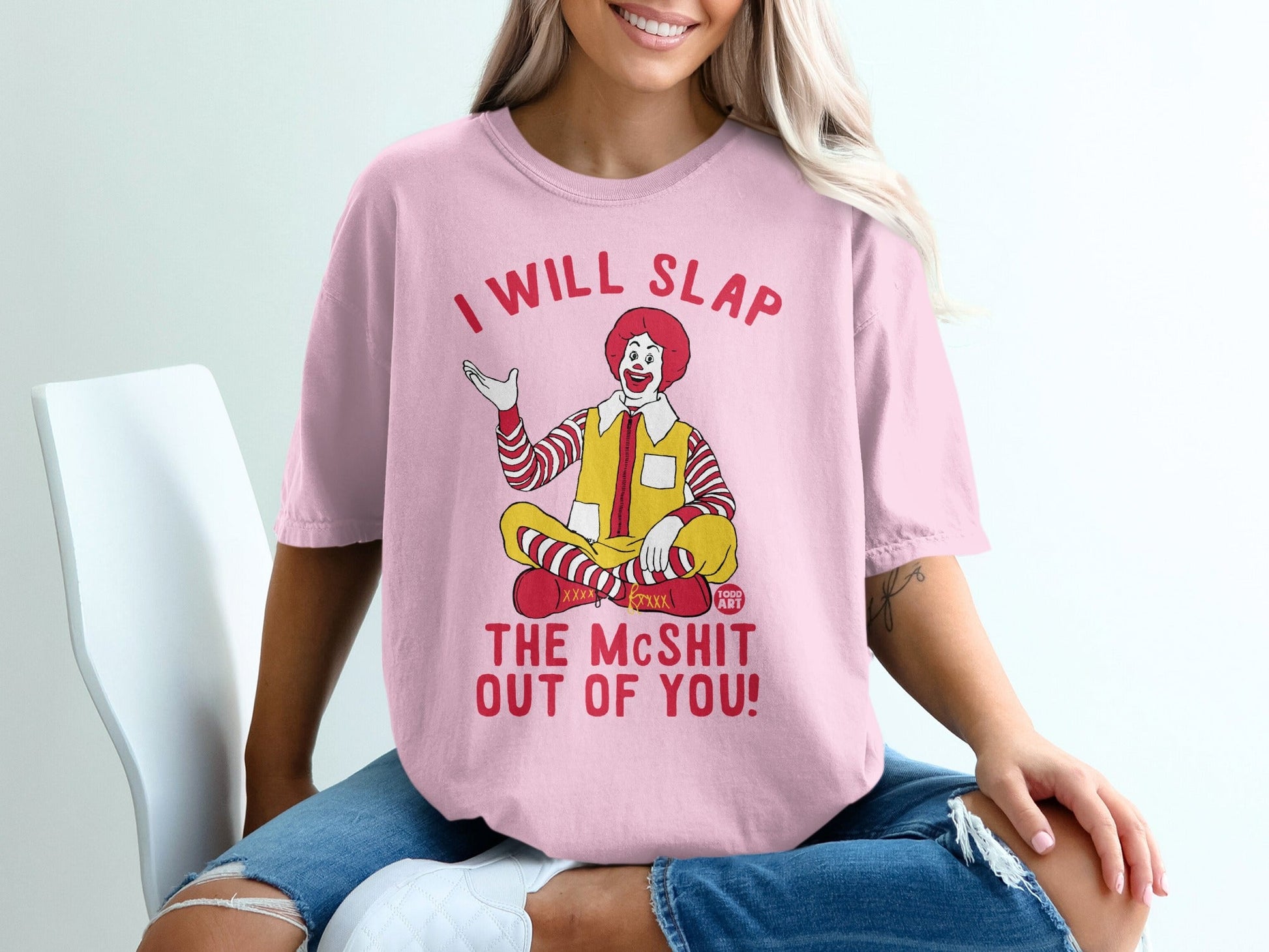 Pink t-shirt with Ronald McDonald graphic and text "I WILL SLAP THE McSHIT OUT OF YOU!".