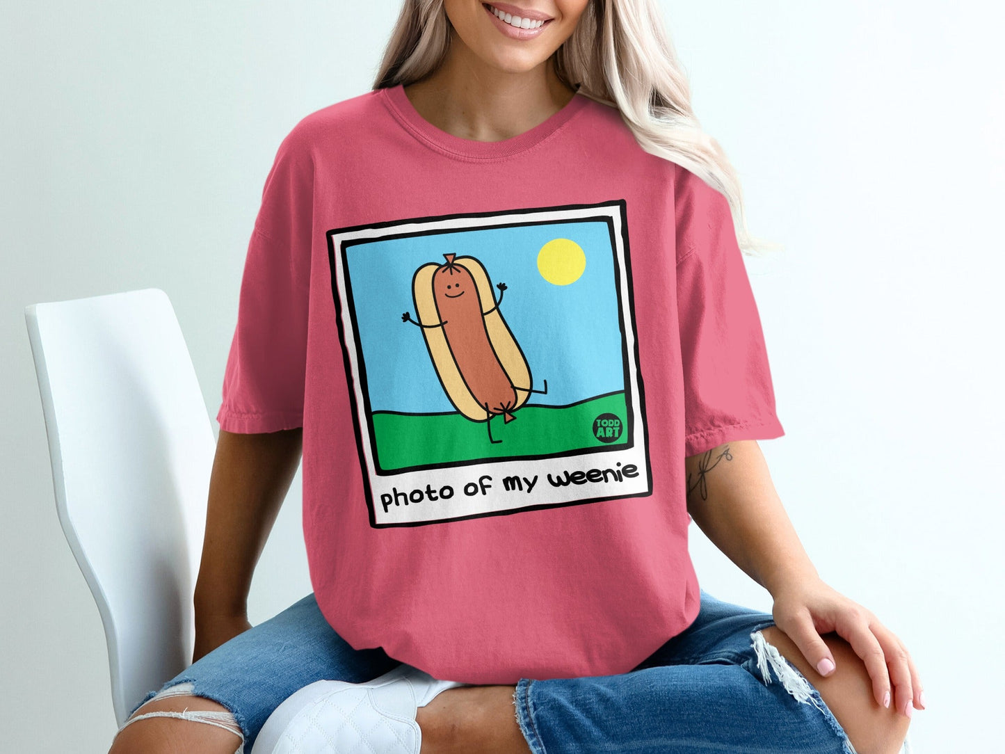 Cartoon hot dog with arms and legs, smiling under the sun.