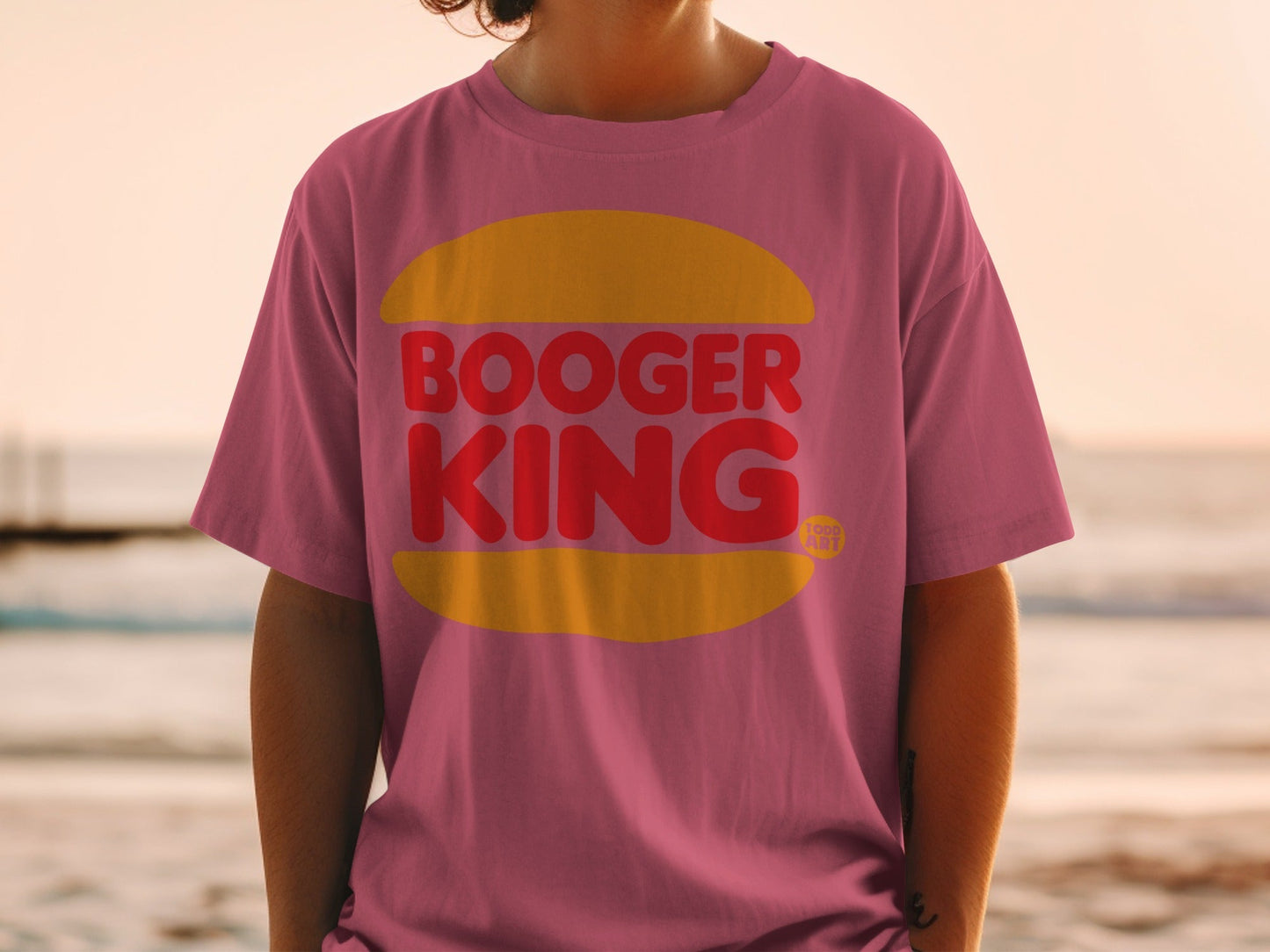 Pink t-shirt with red "BOOGER KING" text in a yellow oval.