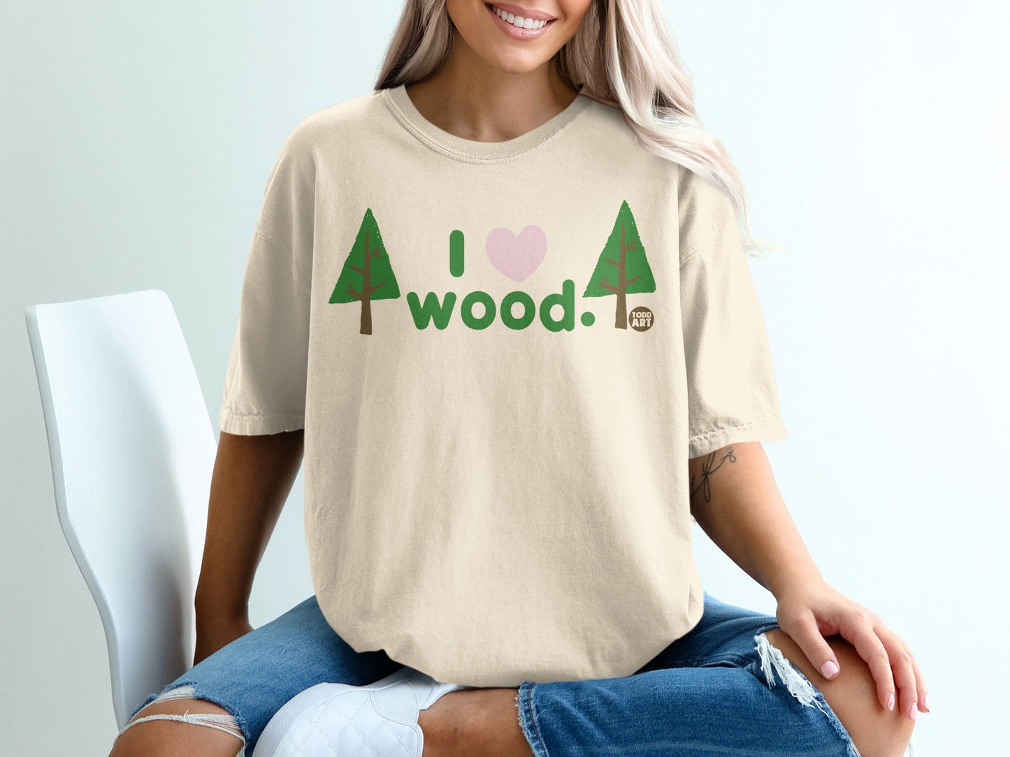 Cream t-shirt with "I love wood" graphic, featuring trees and a heart.