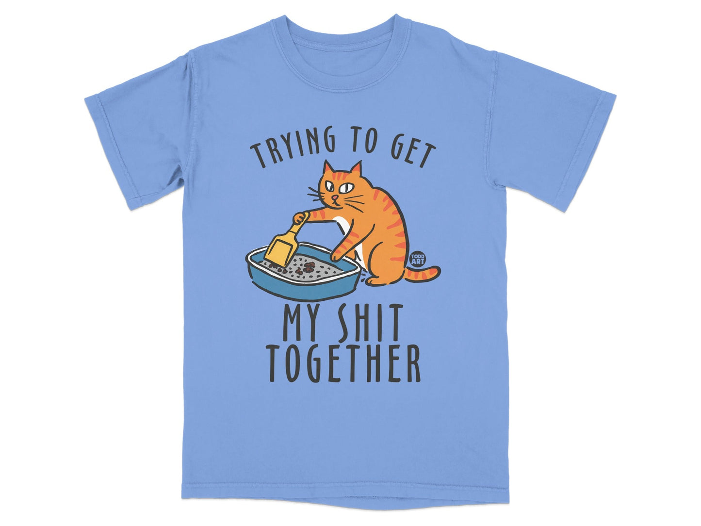 Orange cat cleaning litter box with text "Trying to get my shit together".