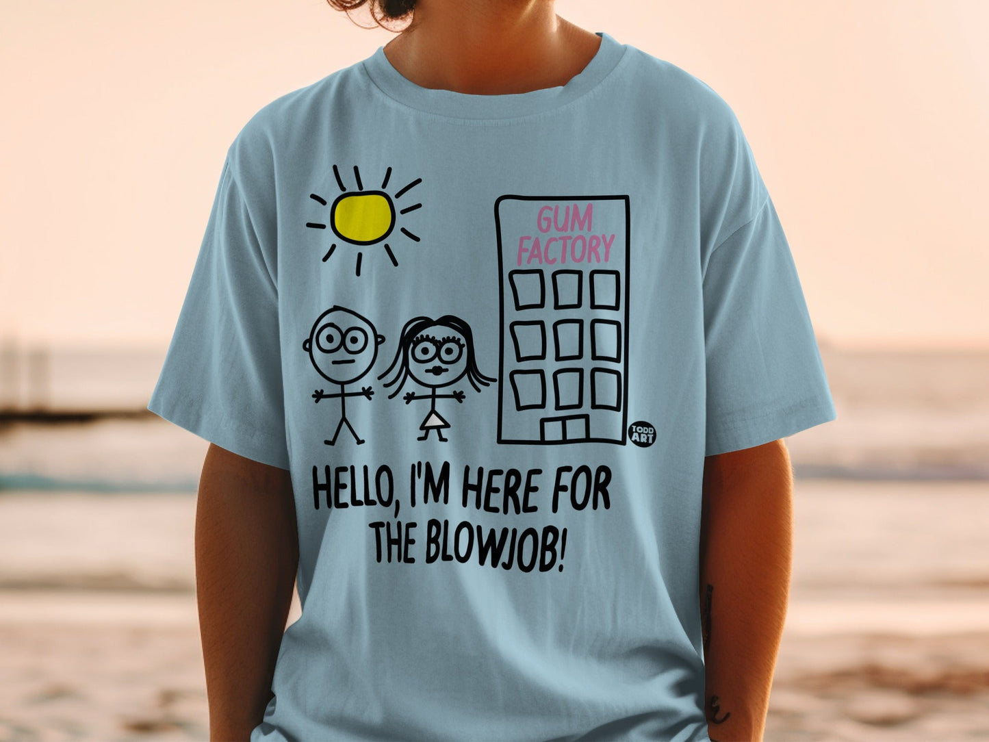Light blue t-shirt with cartoon drawing of a factory, sun, people, and text.