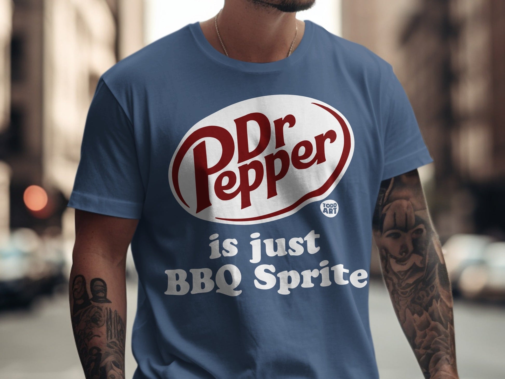 Dr Pepper BBQ Sprite graphic t-shirt on a man with tattoos.