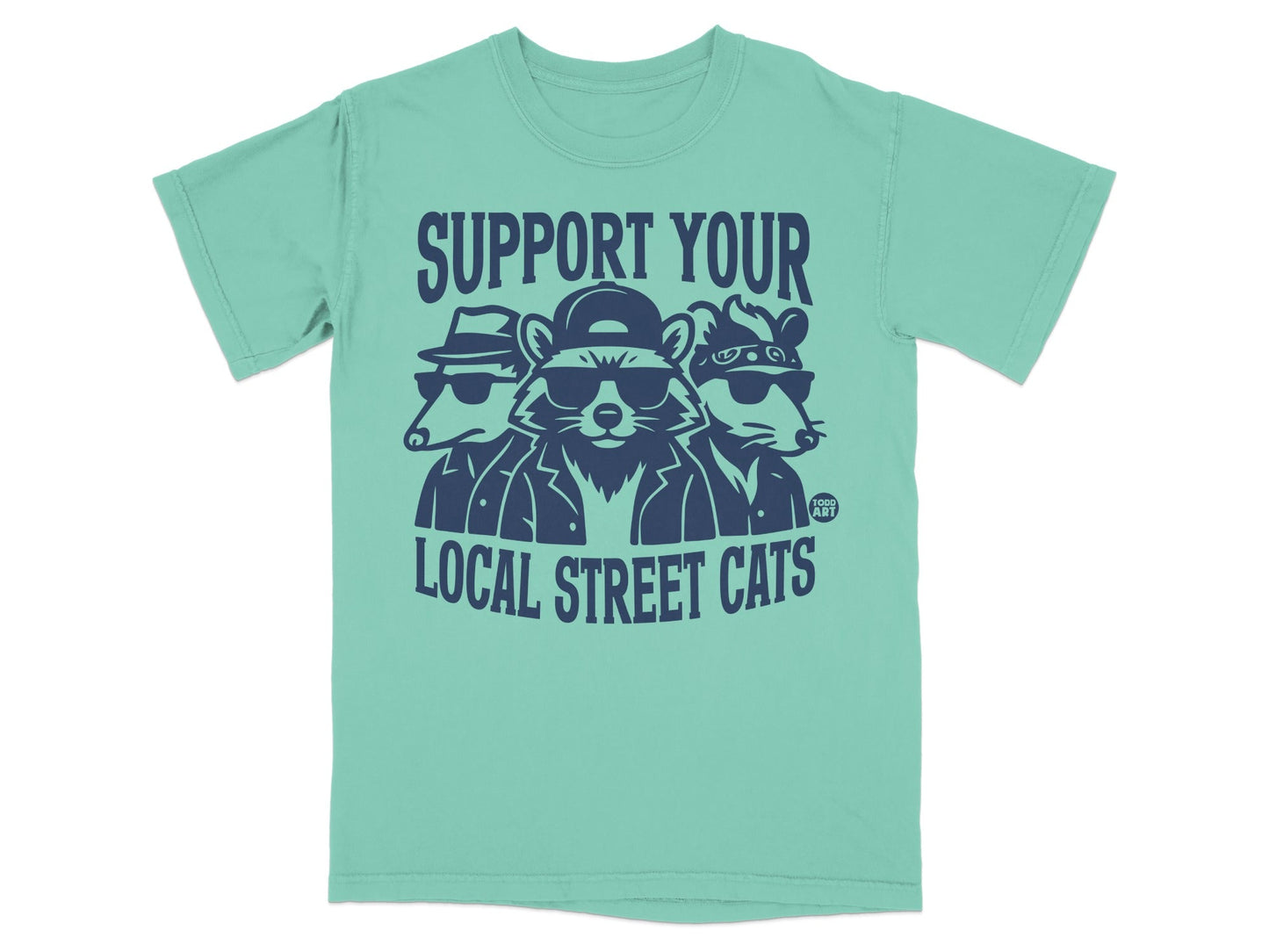 T-shirt with cartoon raccoons wearing sunglasses and hats, saying "Support your local street cats."