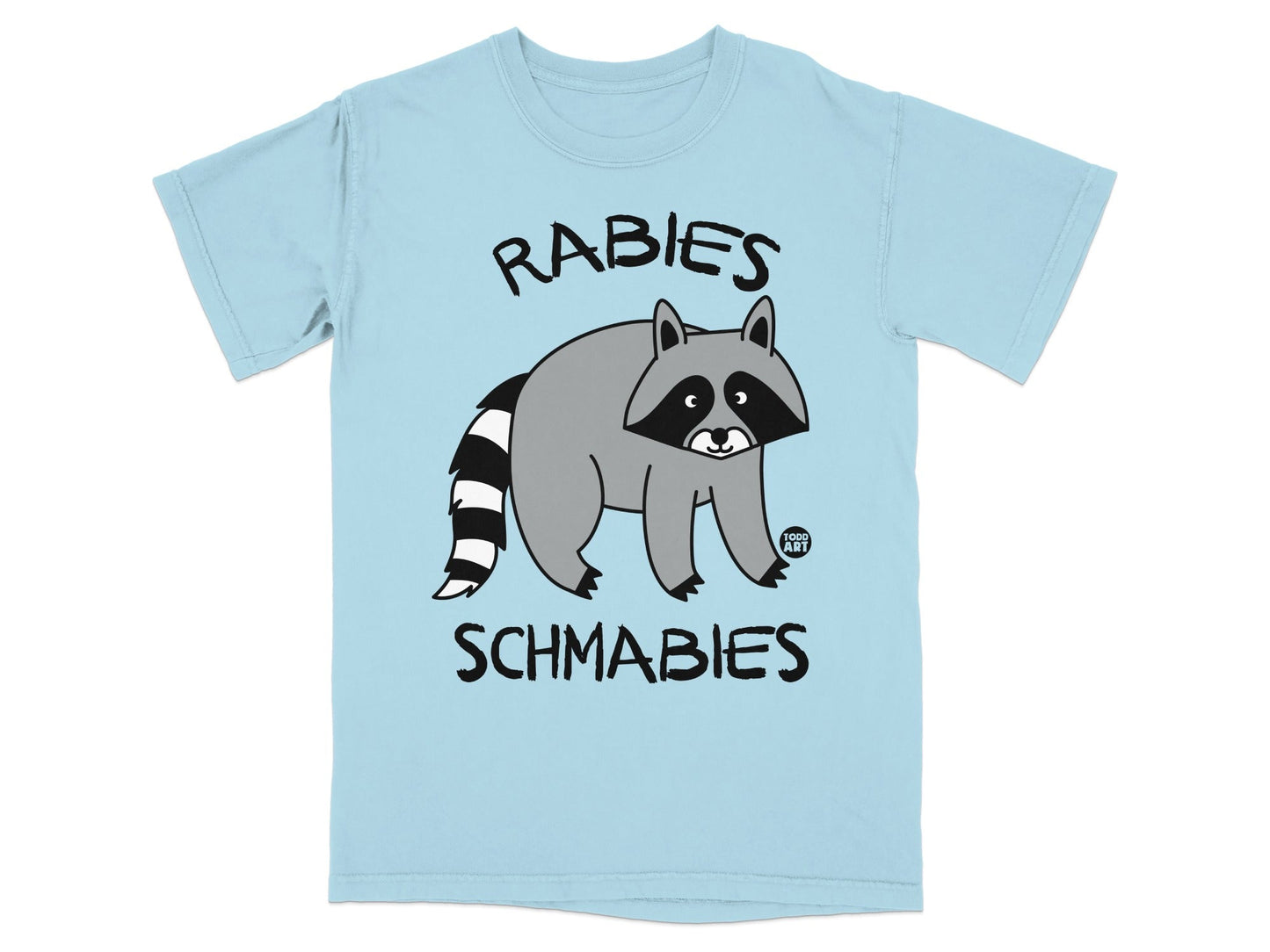 Light blue t-shirt with a cartoon raccoon and text "RABIES SCHMABIES".