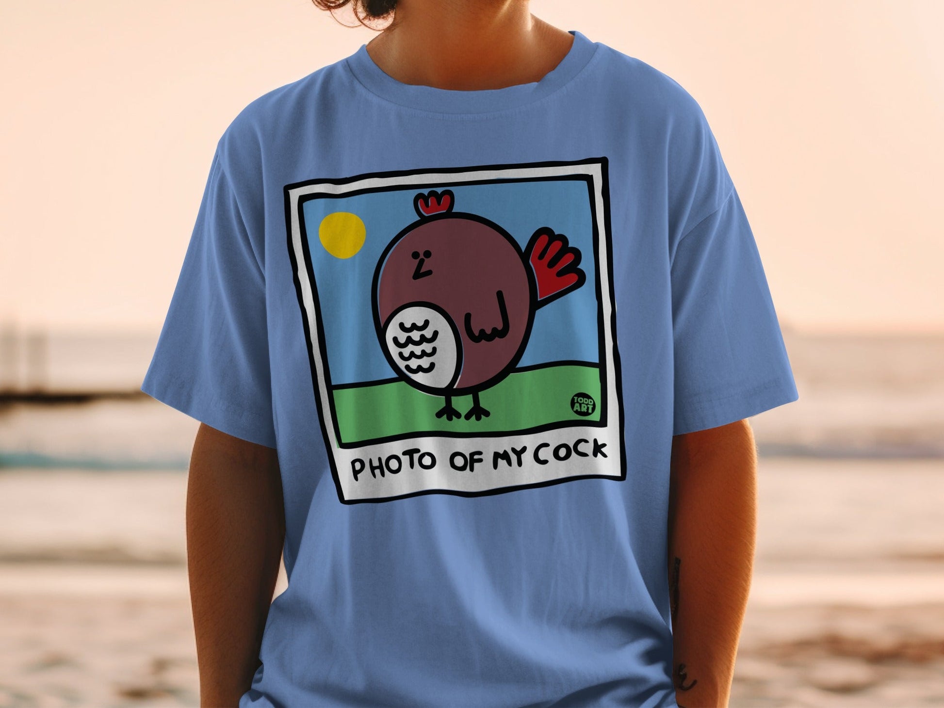 Blue t-shirt with cartoon chicken in a photo frame, "PHOTO OF MY COCK" text.
