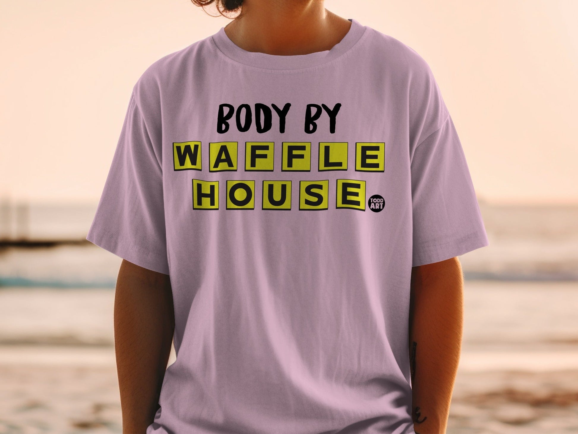 T-shirt with "Body By Waffle House" text and small logo.