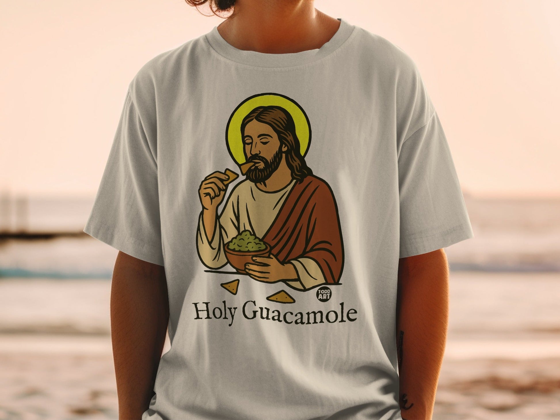 Jesus eating guacamole from a bowl on a t-shirt.