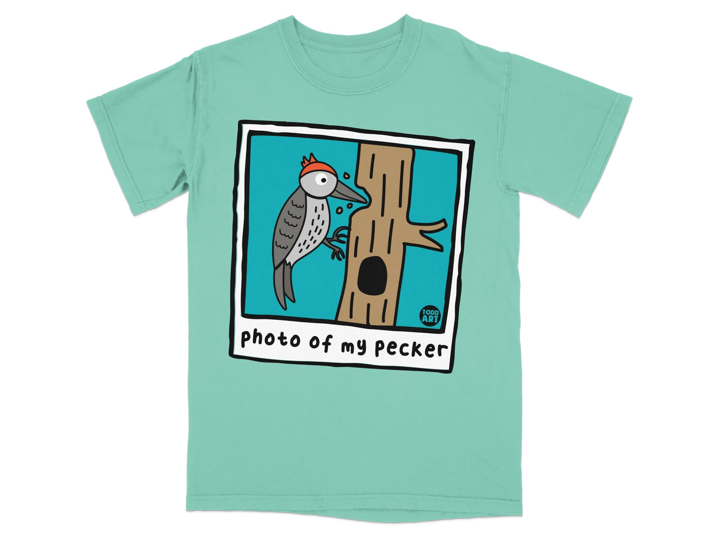 Turquoise t-shirt with a framed illustration of a woodpecker on a tree trunk.