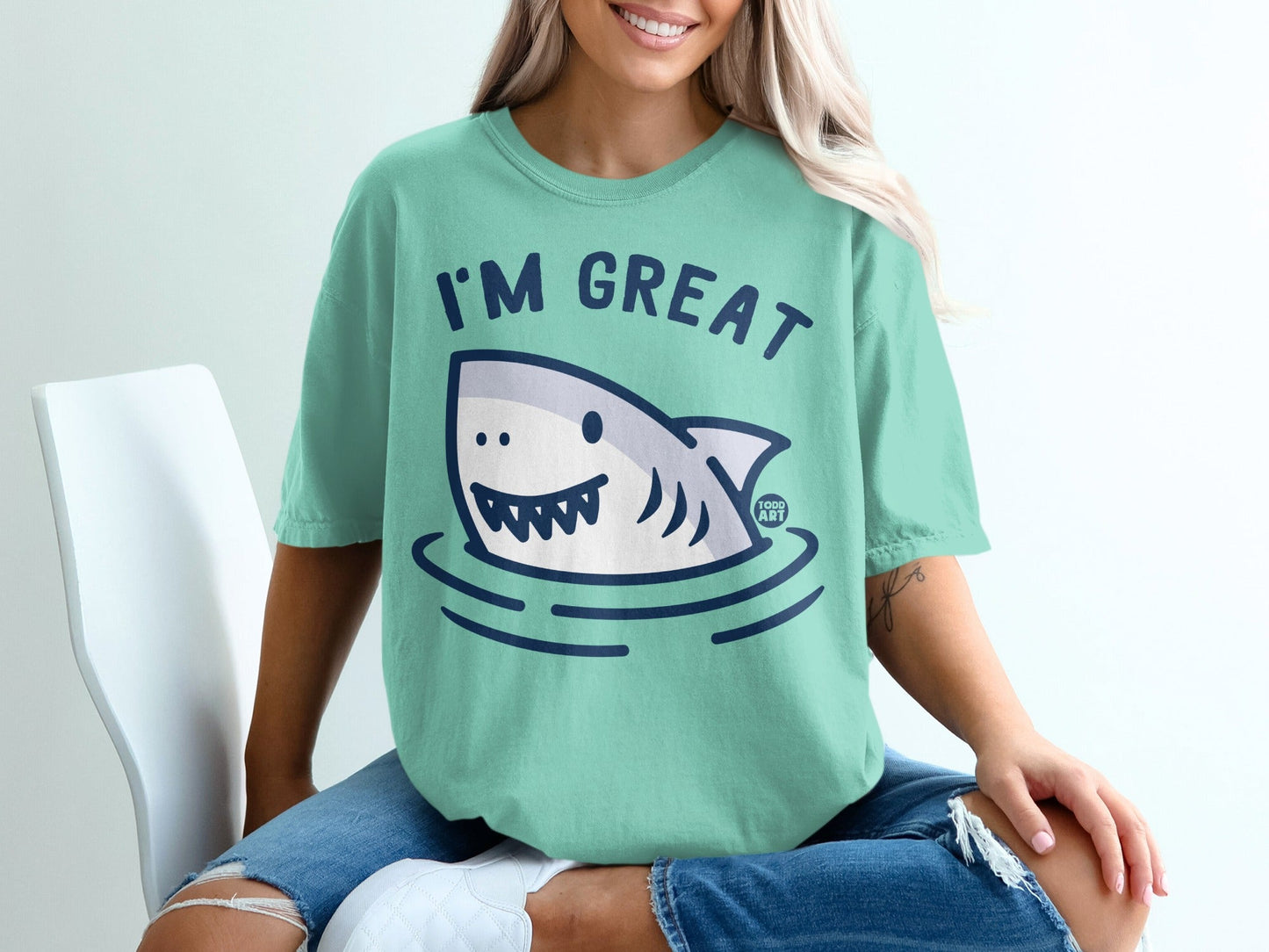 T-shirt with a smiling cartoon shark and text "I'M GREAT"
