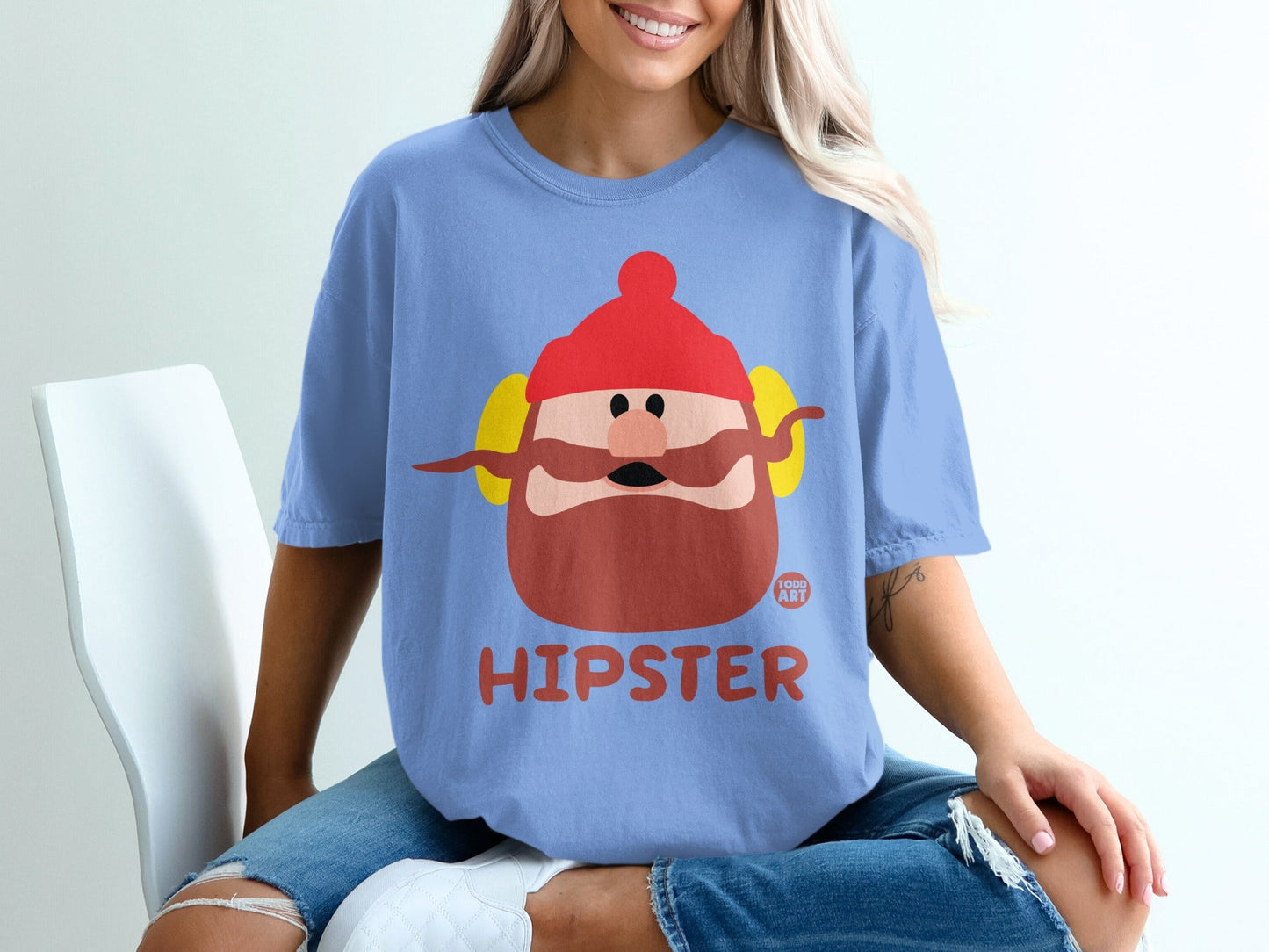 Blue t-shirt with cartoon hipster man graphic and "TODD ART" text.