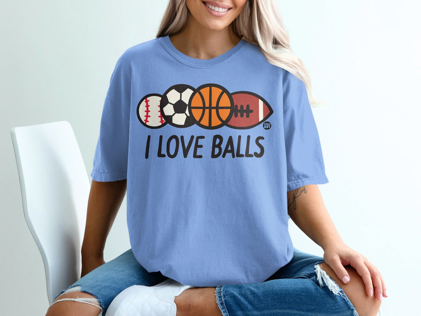 Light blue t-shirt with "I LOVE BALLS" and sports balls graphic.