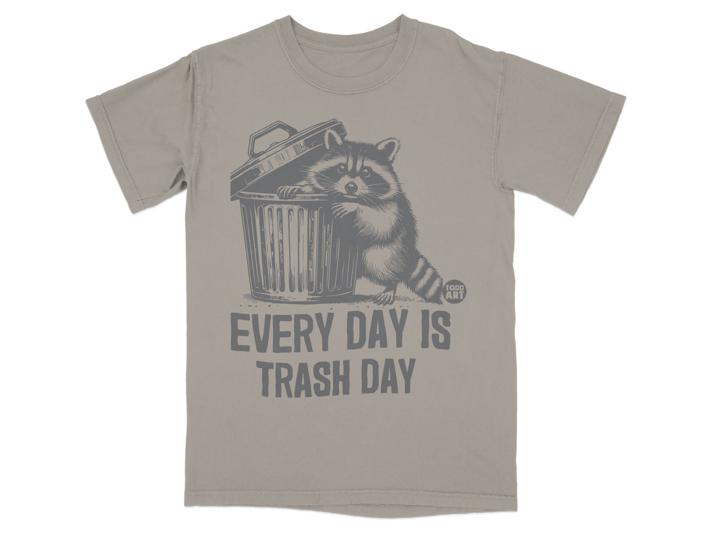 T-shirt with raccoon peeking from trash can, text "EVERY DAY IS TRASH DAY".