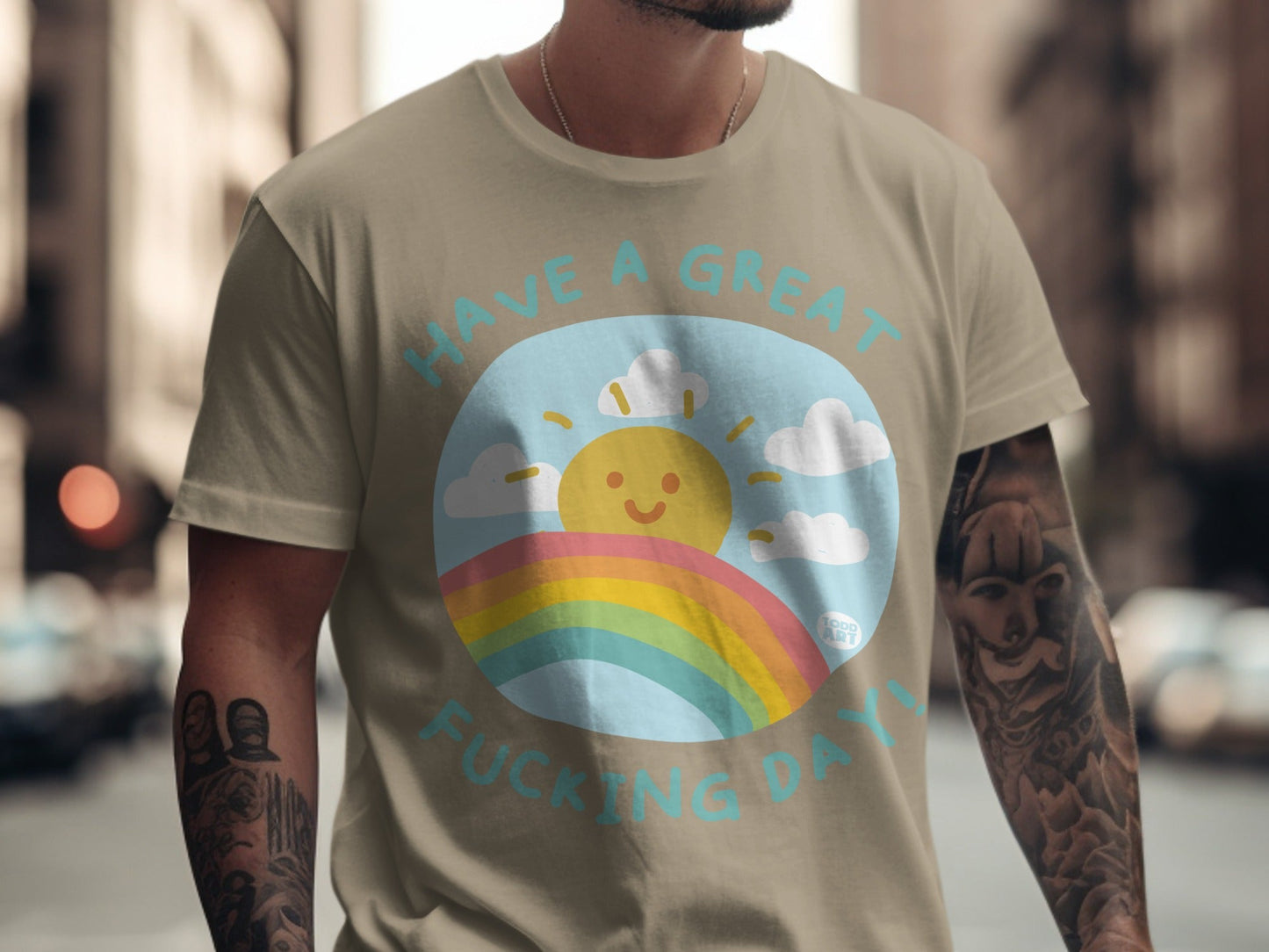 T-shirt with text "HAVE A GREAT FUCKING DAY" above a smiling sun and rainbow.