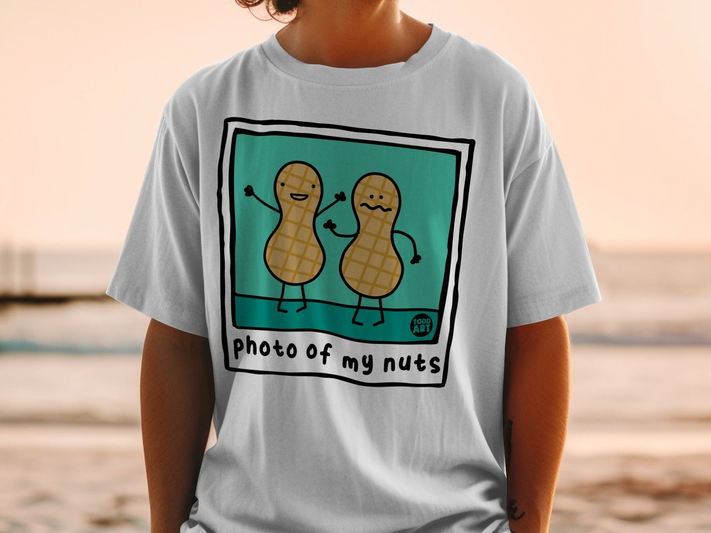 Two cartoon peanuts with arms raised, "photo of my nuts" text.