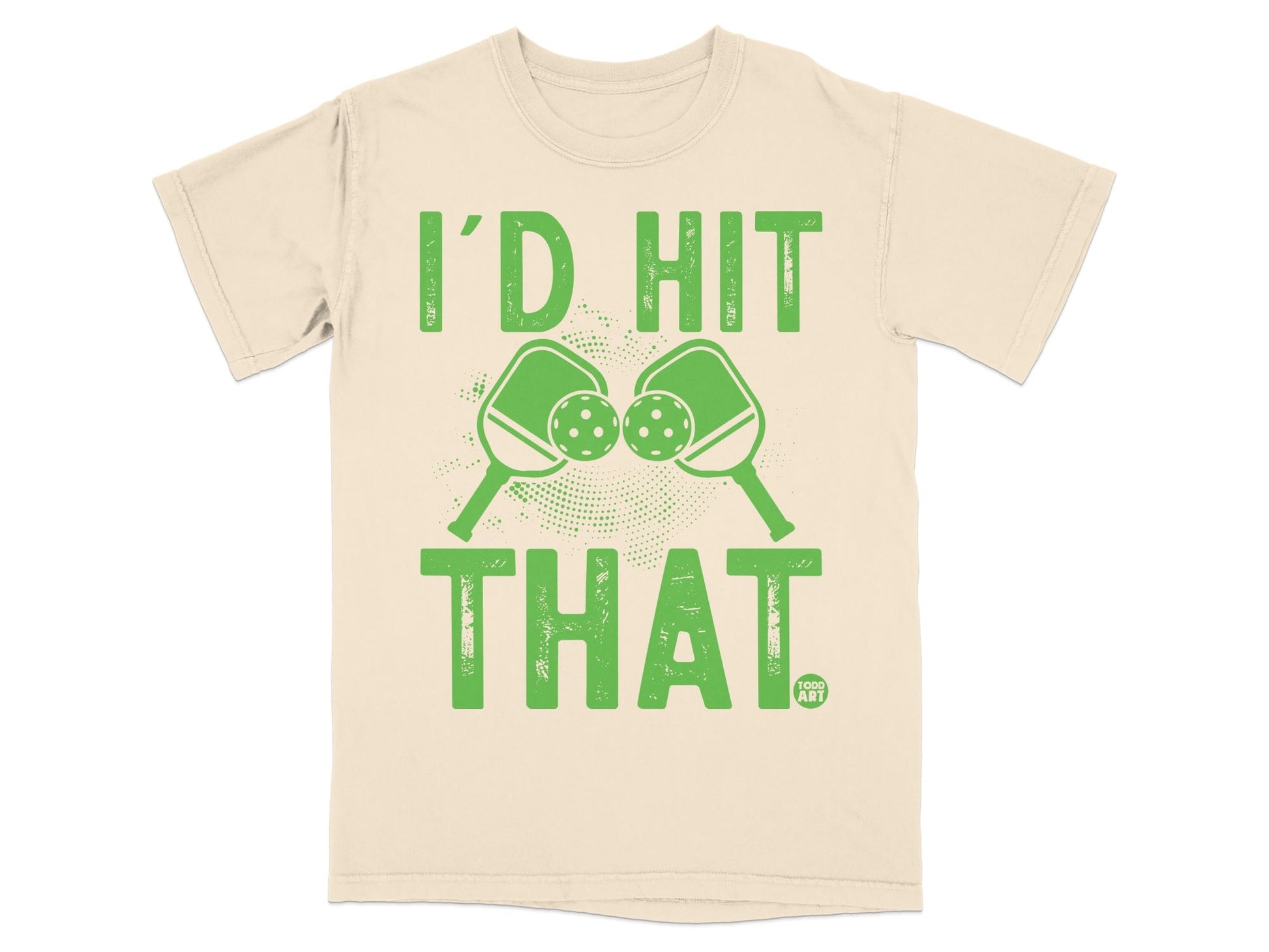 Cream t-shirt with green text "I'D HIT THAT" and crossed pickleball paddles and balls.