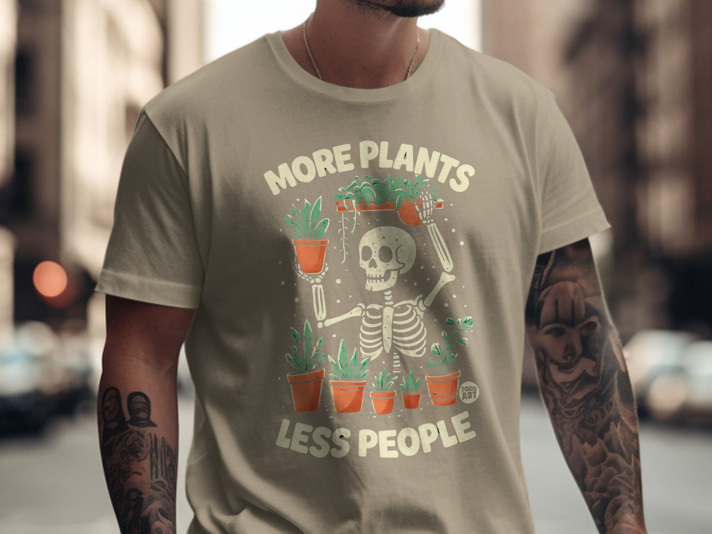 Skeleton graphic t-shirt with plants and text "More Plants Less People".