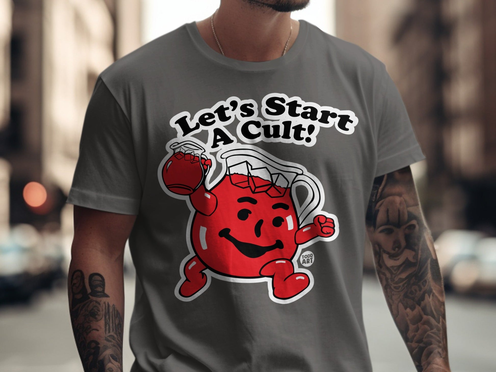 Grey t-shirt with Kool-Aid Man character saying "Let's Start a Cult!"