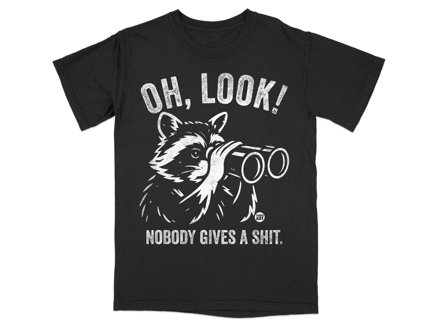 T-shirt with raccoon wearing binoculars and "OH, LOOK! NOBODY GIVES A SHIT." text.