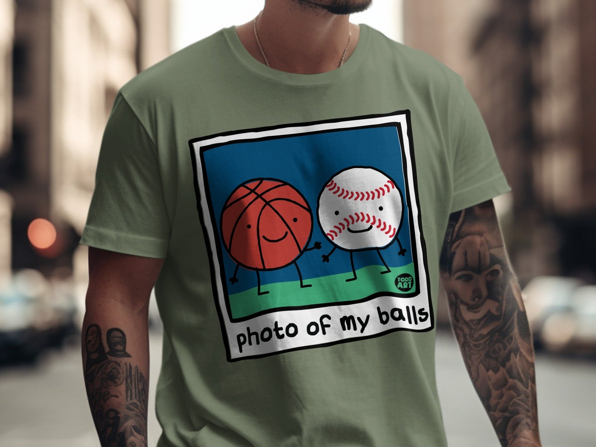 Basketball and baseball characters smiling in a photo frame with "photo of my balls" text.