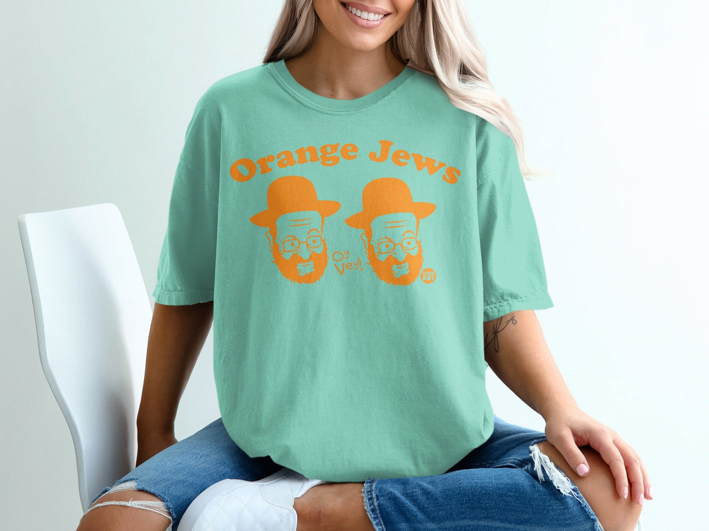 Teal t-shirt with "Orange Jews Oy Vey" text and illustrated Jewish men.