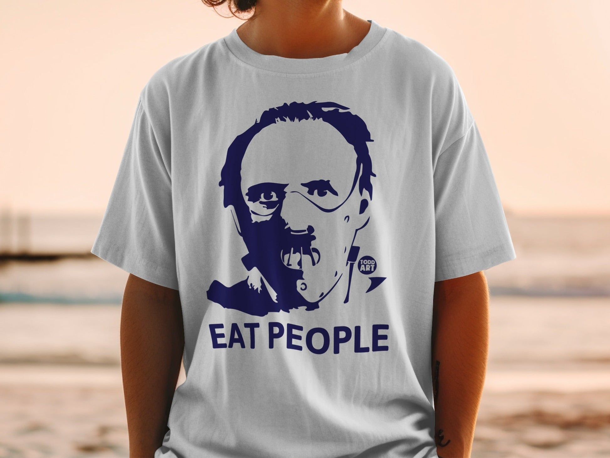 White t-shirt with dark blue graphic of a face and "EAT PEOPLE" text.