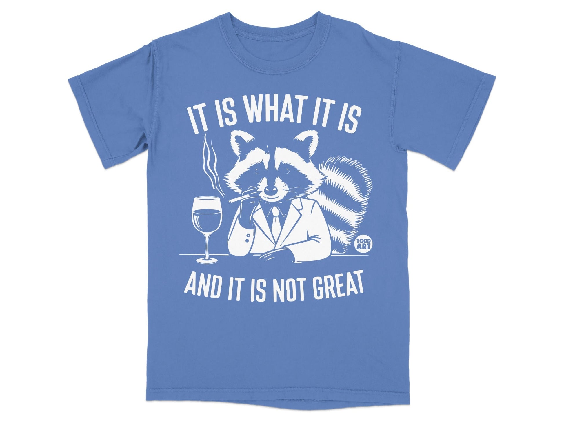 Blue t-shirt with raccoon in suit smoking, "It is what it is and it is not great."
