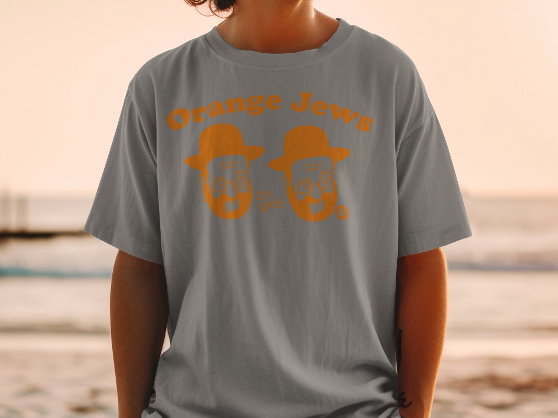 Gray t-shirt with orange "Orange Jews" text and cartoon faces.