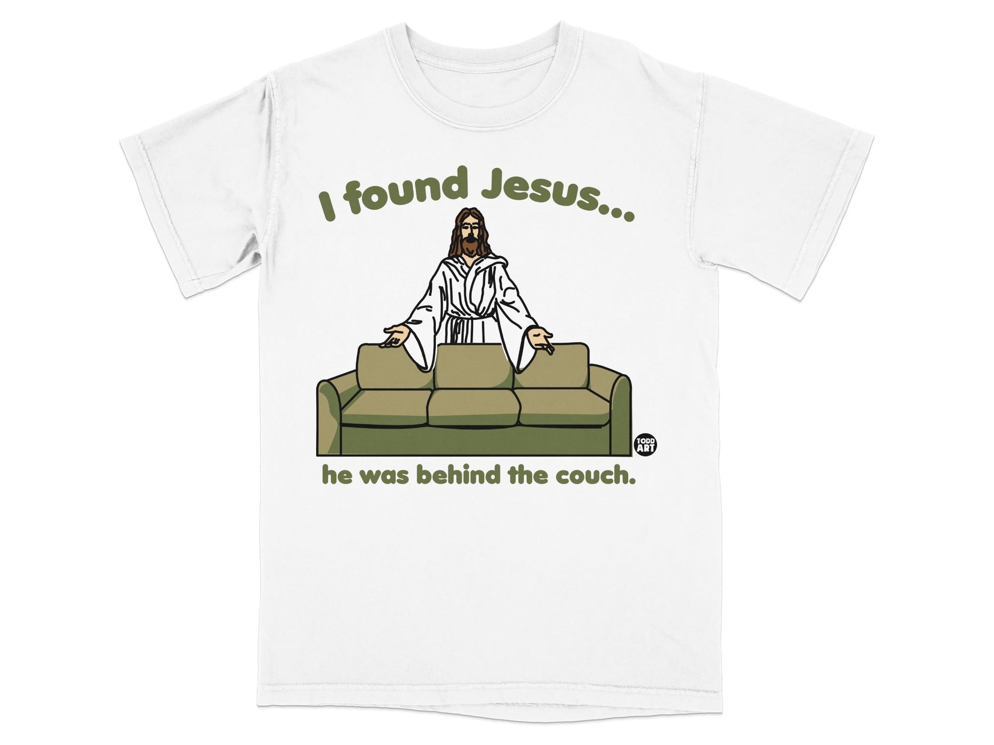 White t-shirt with Jesus behind a couch, text says "I found Jesus... he was behind the couch."