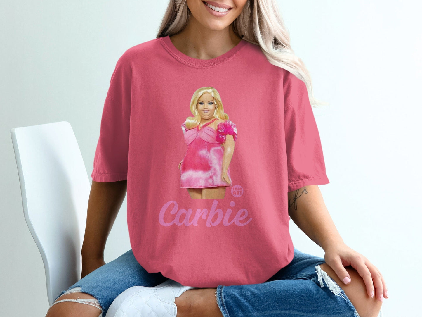 Pink t-shirt featuring Barbie graphic with "Barbie" text.