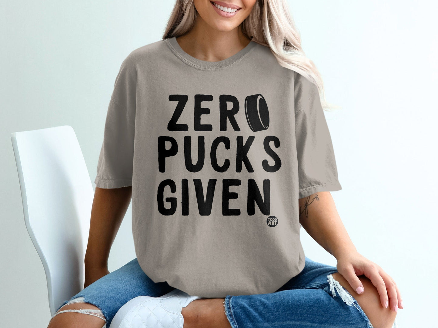 Comfort Colors t-shirt with "ZERO PUCKS GIVEN" printed in black.