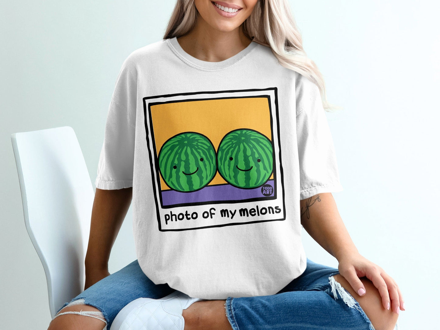 White t-shirt with "photo of my melons" and two smiling cartoon watermelons.