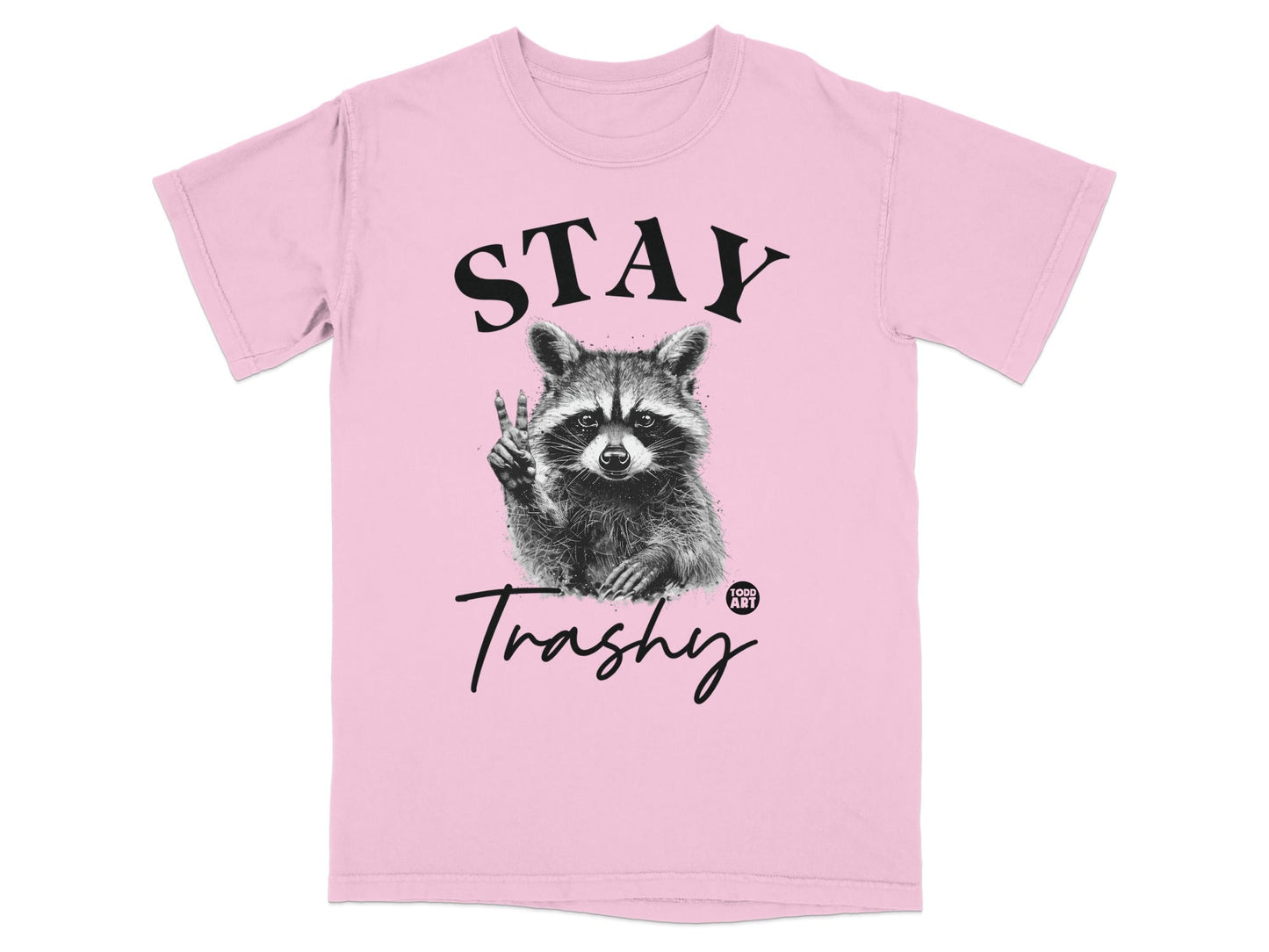 Pink t-shirt with a raccoon giving peace sign and "STAY Trashy" text.
