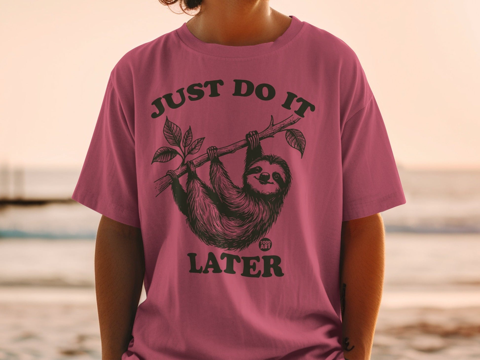 T-shirt with sloth hanging from a branch, text "JUST DO IT LATER".
