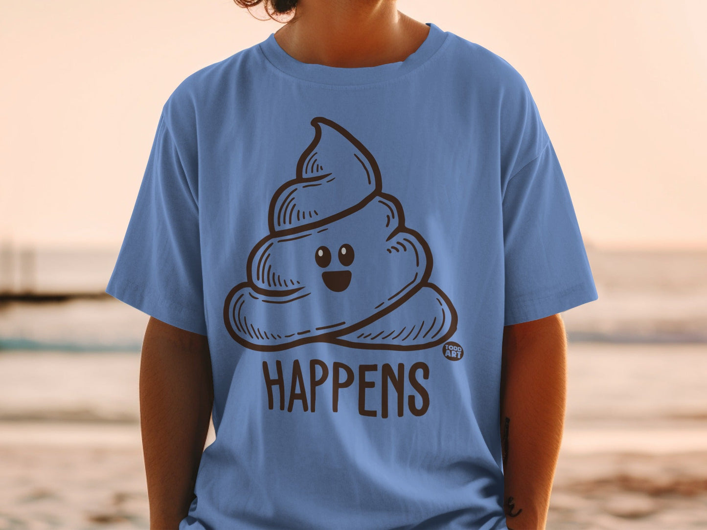 Blue t-shirt with cartoon poop emoji and "HAPPENS" text.