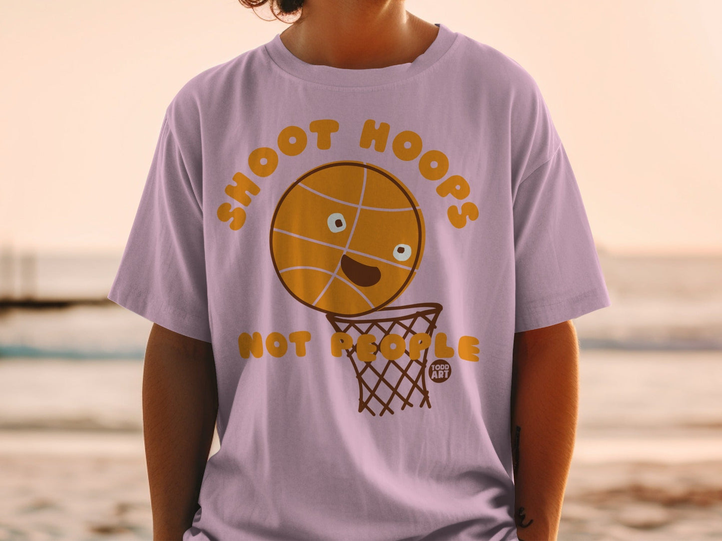 T-shirt with a cartoon basketball and net, reads "SHOOT HOOPS".