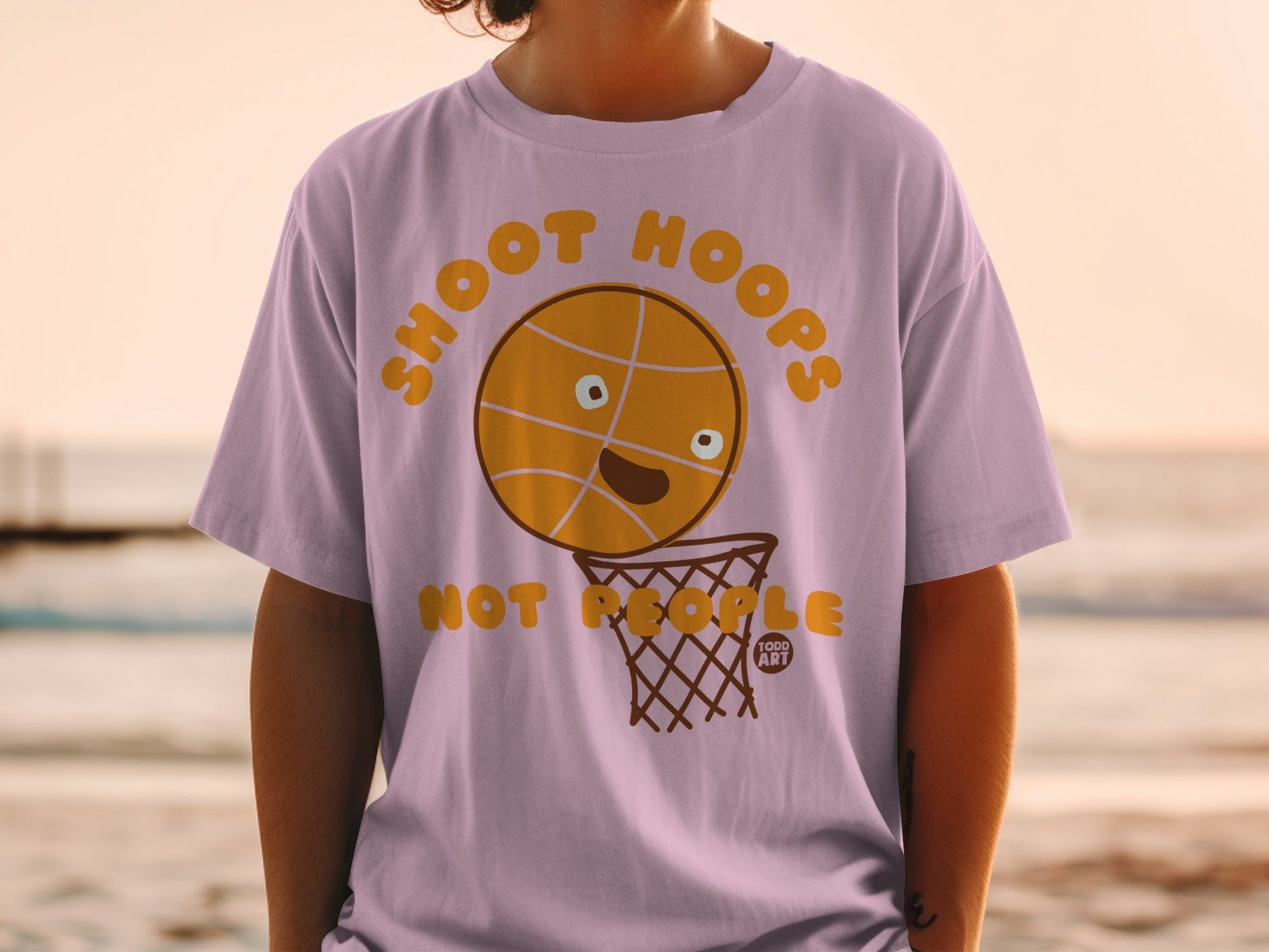 T-shirt with a cartoon basketball and net, reads "SHOOT HOOPS".