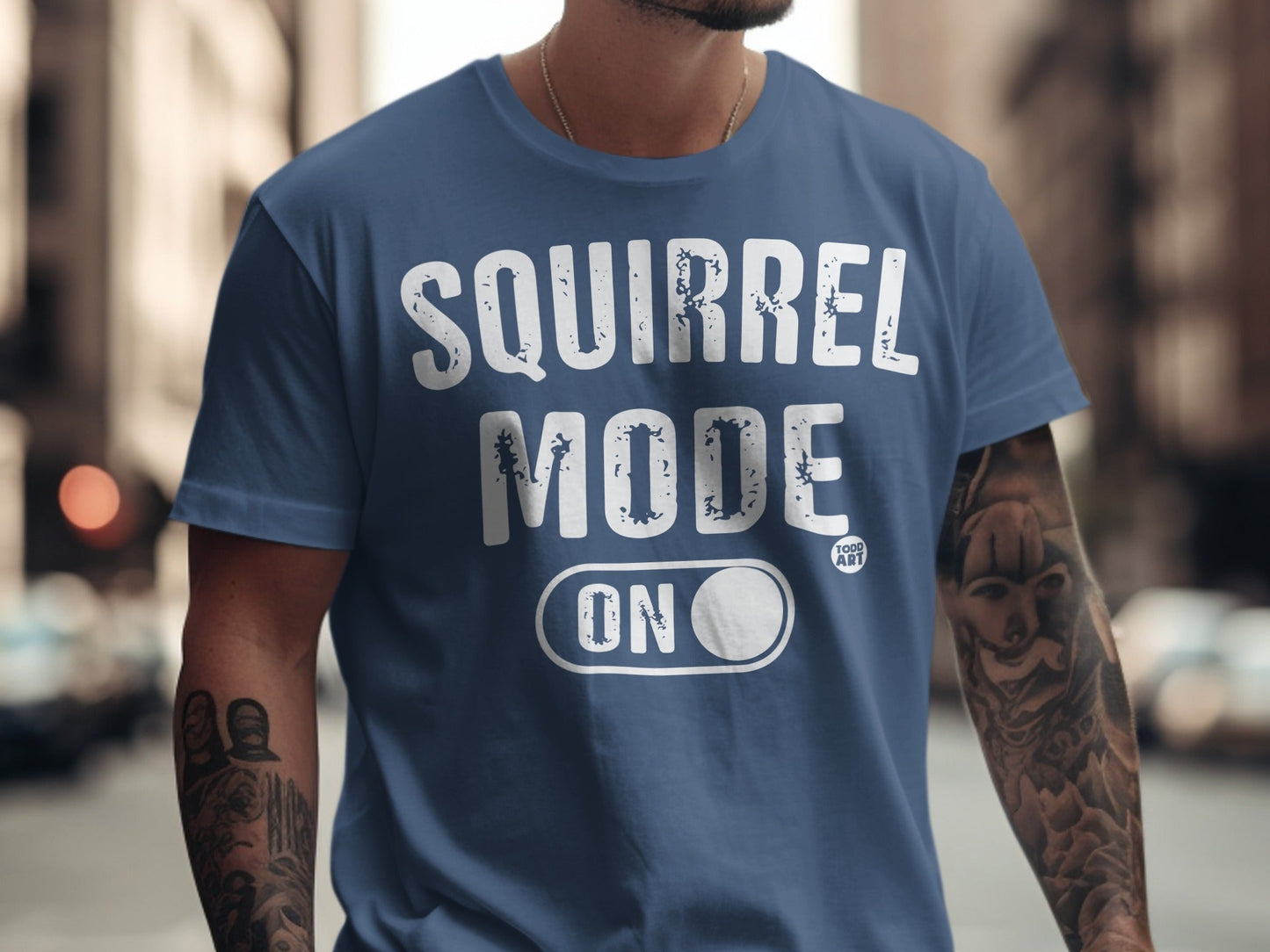 Blue t-shirt with "SQUIRREL MODE ON" text and a toggle switch.