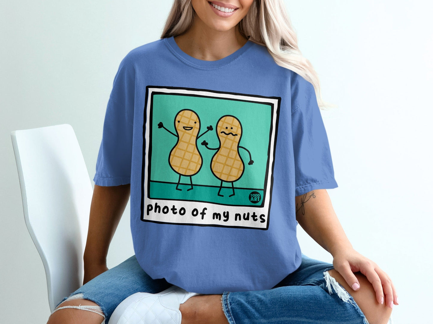 Two cartoon peanuts with arms raised, "photo of my nuts" text.