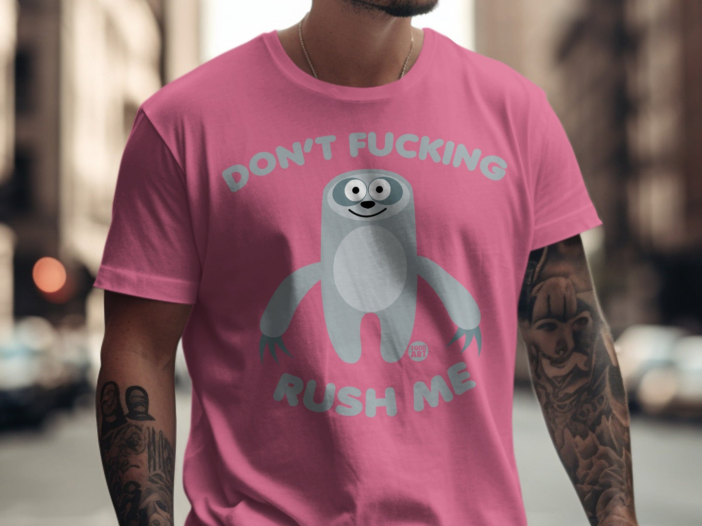 Pink t-shirt with cartoon sloth graphic and "Don't Fucking Rush Me" text.