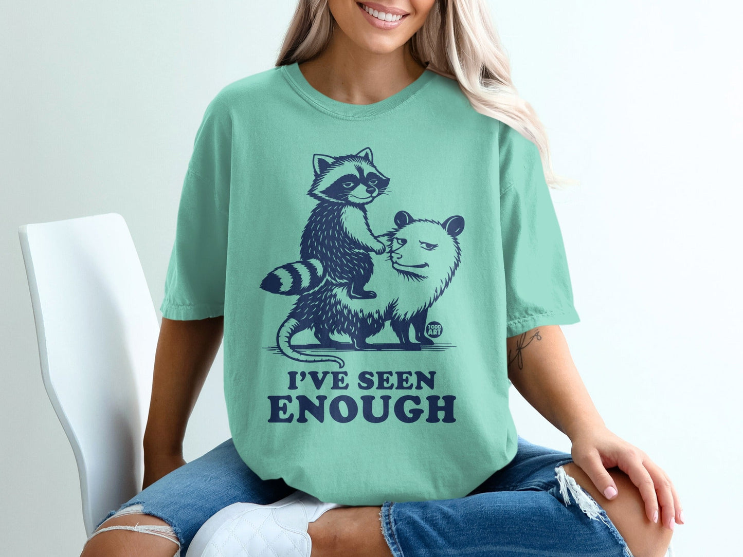 Raccoon riding opossum graphic tee with "I'VE SEEN ENOUGH" text.