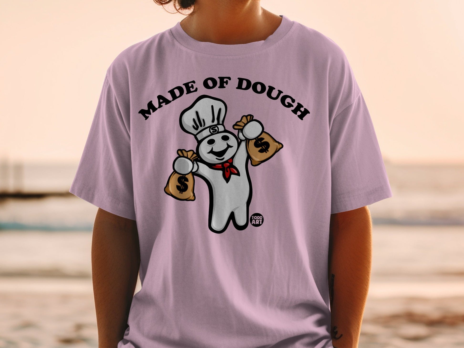 Pillsbury Doughboy wearing chef hat holding money bags, text "MADE OF DOUGH".