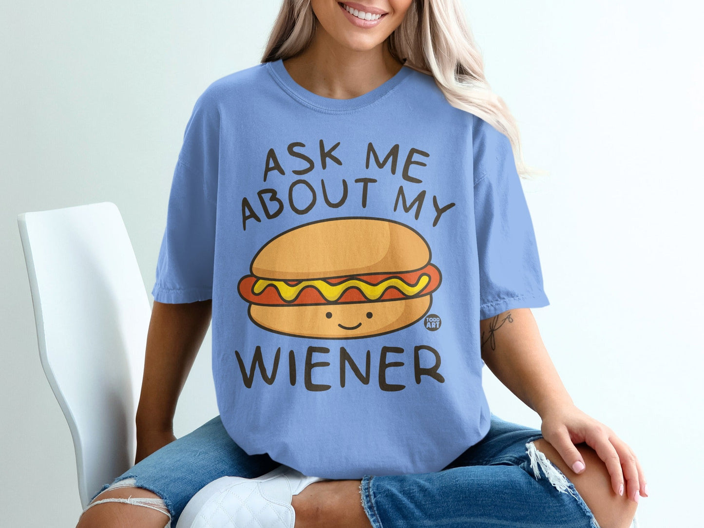 Light blue t-shirt with "Ask Me About My Wiener" and a smiling hot dog graphic.